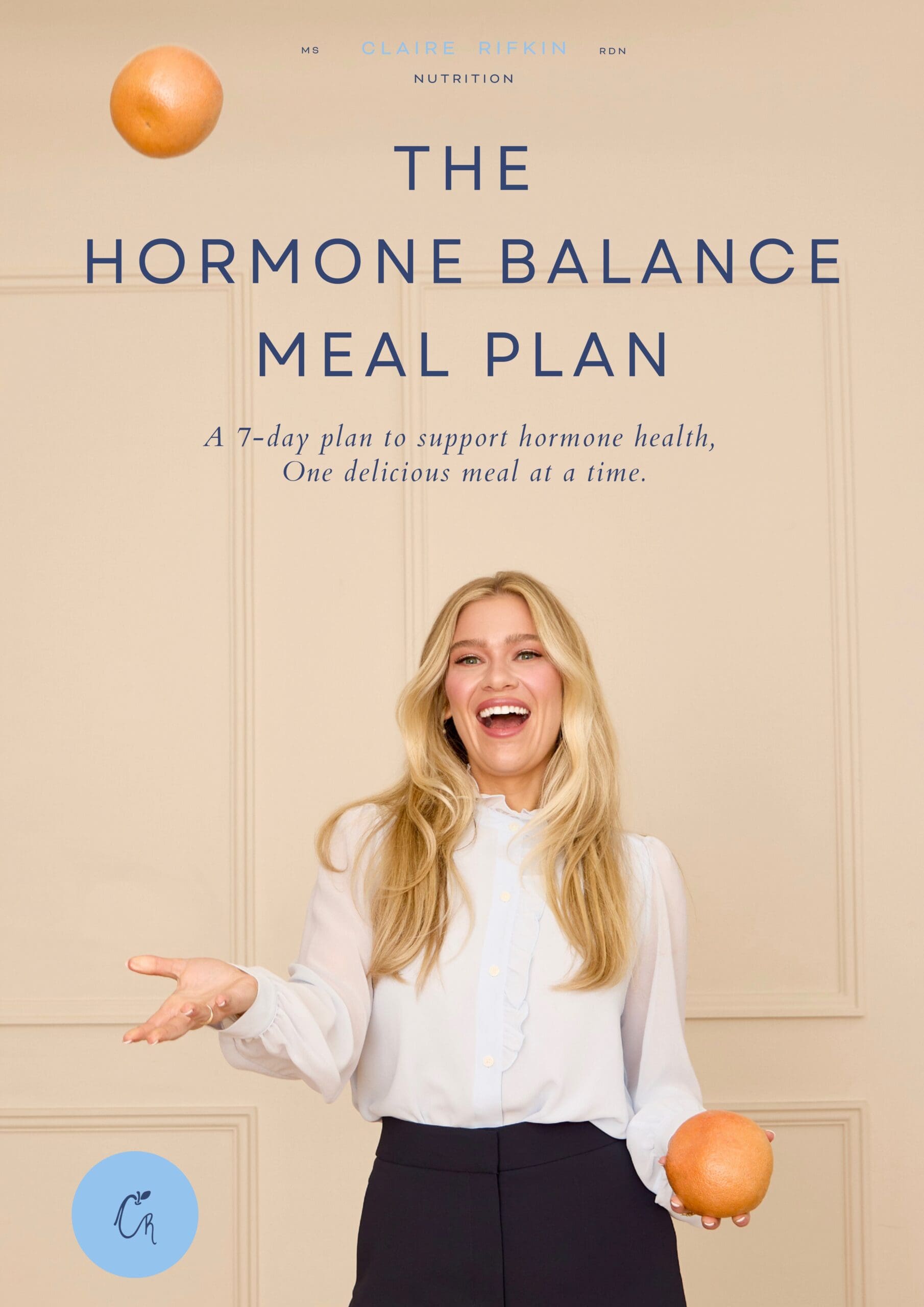 Claire Rifkin smiling while holding grapefruit, promoting the 7-Day Hormone Reset meal plan for women’s hormone health.