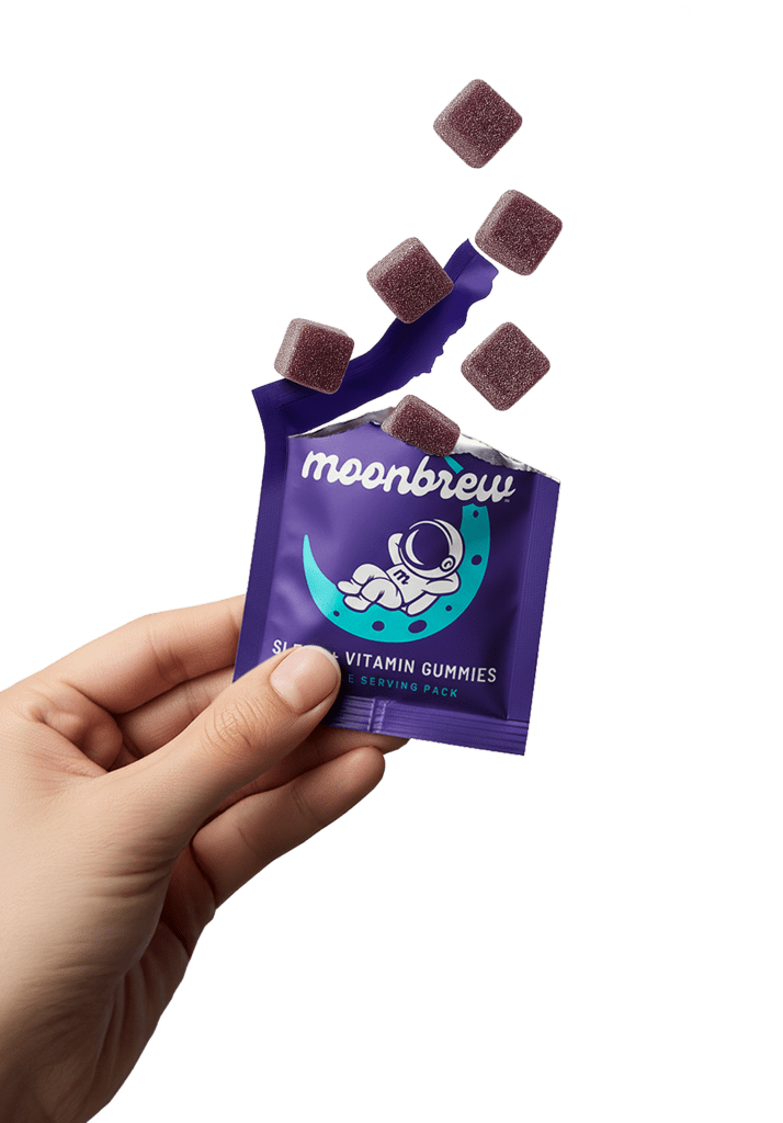 MoonBrew sleep vitamin gummies in a purple single-serve pouch, held in hand with gummies spilling out.